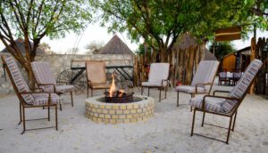 a fire pit with chairs around it